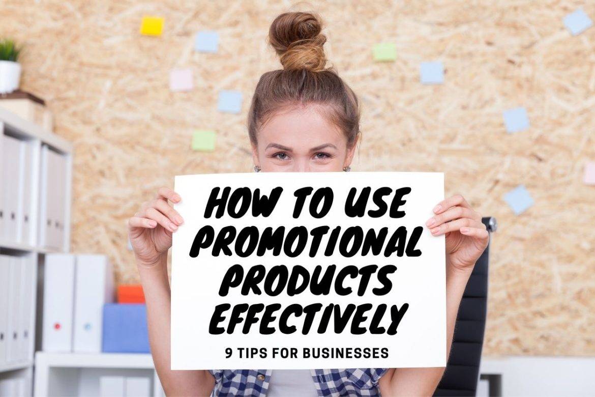 Woman with hair in bun holding sign reading, "How to Use Promotional Products Effectively: 9 Tips for Businesses"