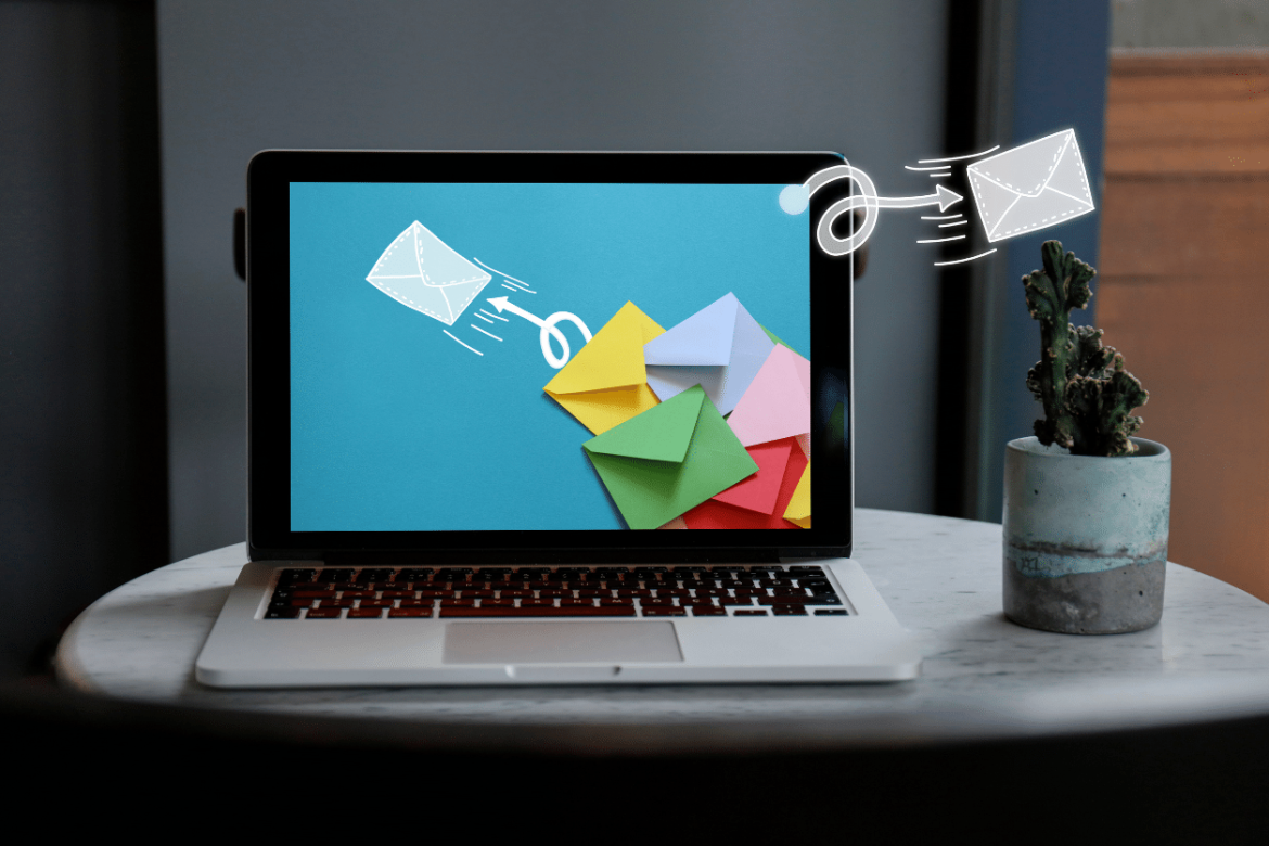 Laptop with colorful envelopes on screen to represent email marketing