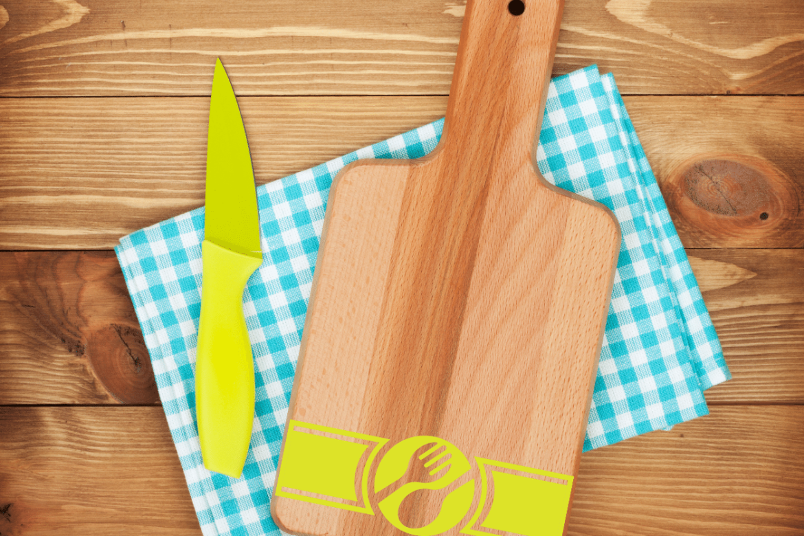 Cutting board with green company logo and other handy kitchen items