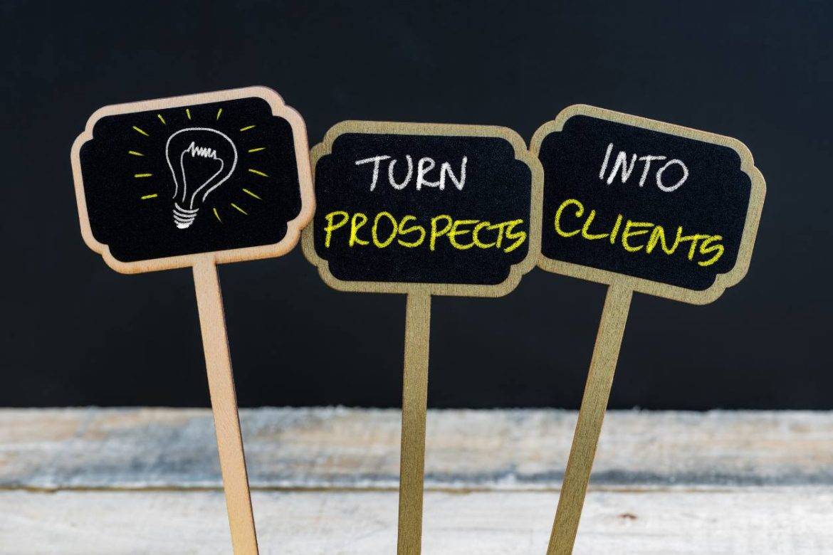 Three chalkboard signs that say Turn Prospects into Clients and a drawing of a lightbulb