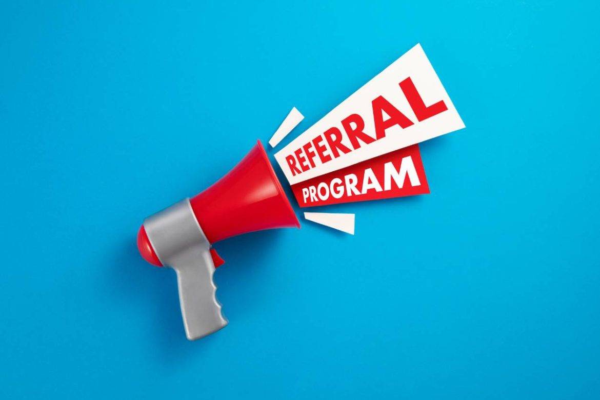Red and gray megaphone with the words Referral Program coming from it