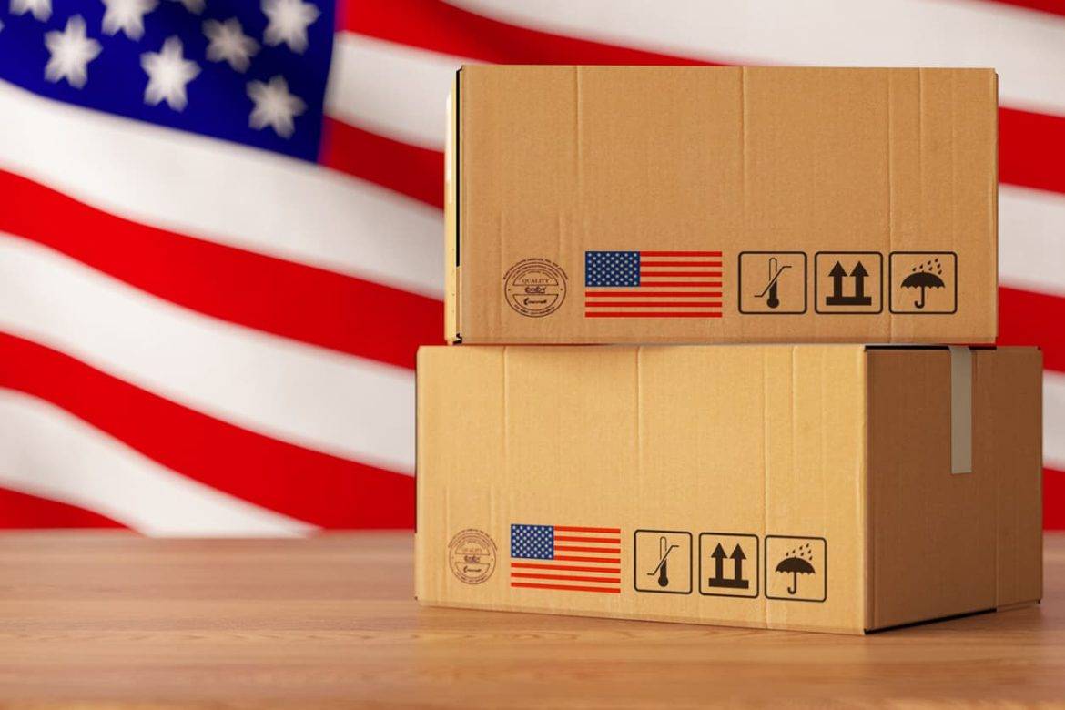 Package Delivery to USA Concept with Cargo Boxes and American Flag